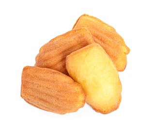 Pile of delicious madeleine cakes on white background, top view