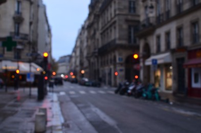 Blurred view of street with beautiful buildings and cars