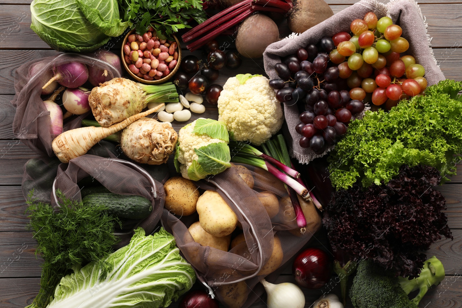 Photo of Different fresh ripe vegetables and fruits on wooden table, flat lay