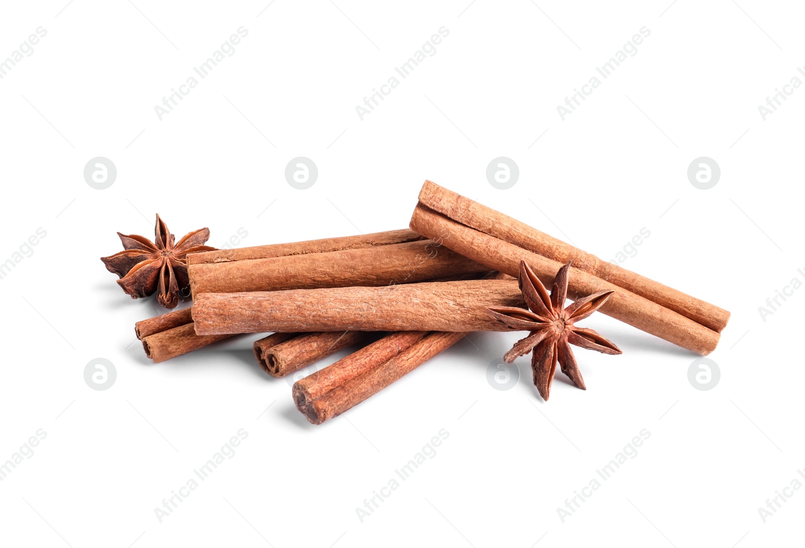 Photo of Aromatic cinnamon sticks and anise stars isolated on white