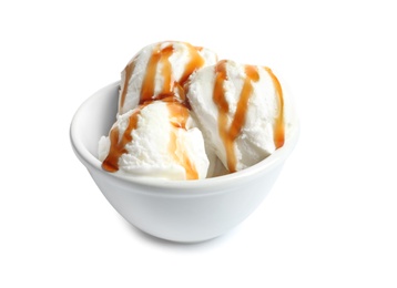 Photo of Tasty ice cream with caramel sauce in bowl on white background