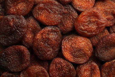 Photo of Tasty dried apricots as background, top view. Healthy snack