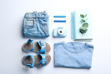 Flat lay composition with little photographer's toy camera on white background
