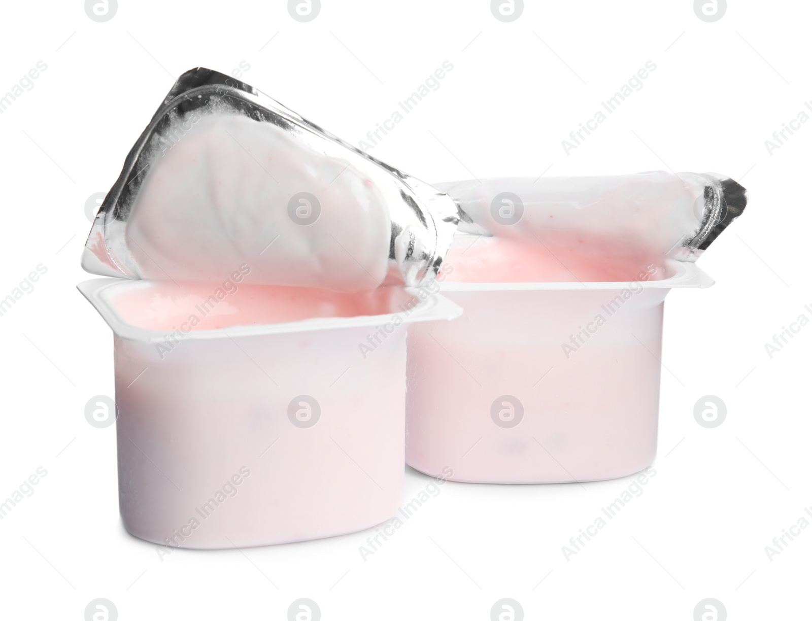 Photo of Tasty organic yogurt in plastic cups isolated on white