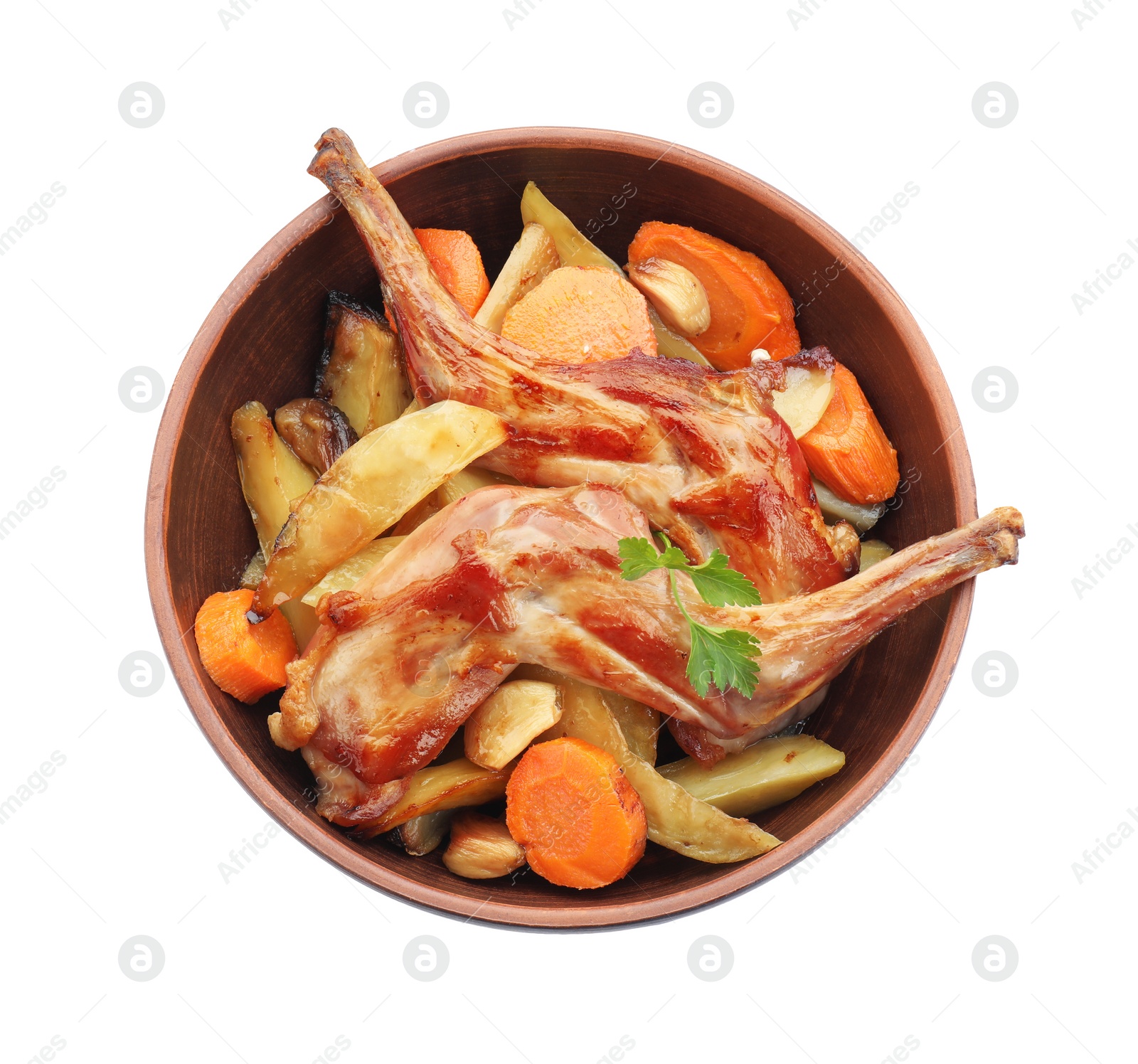 Photo of Tasty cooked rabbit with vegetables in bowl isolated on white, top view