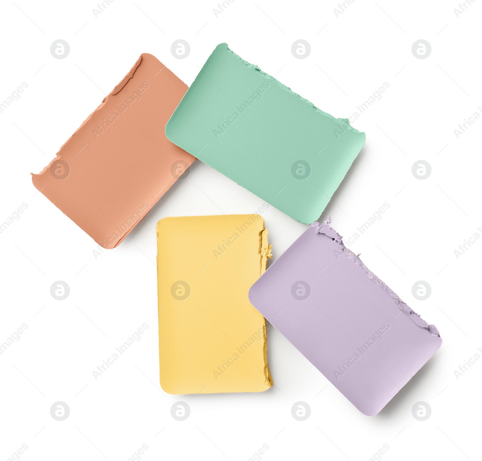 Photo of Different color correcting concealers isolated on white, top view