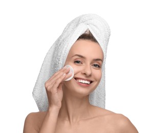 Photo of Smiling woman removing makeup with cotton pad on white background