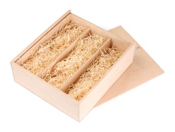 Photo of Open wooden wine box with straw isolated on white