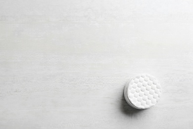 Photo of Stack of soft cotton pads on light background, top view with space for text