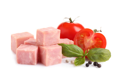 Photo of Cubes of tasty fresh ham with basil, tomatoes and pepper isolated on white