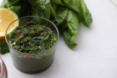 Photo of Fresh homemade marinade in bowl on table, closeup. Space for text