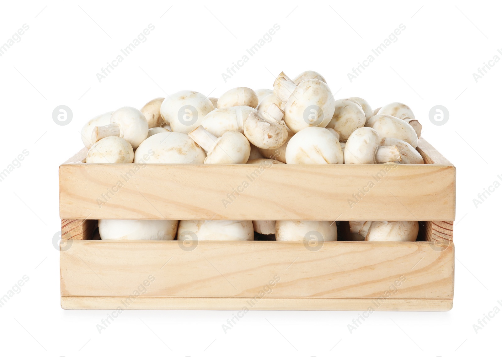 Photo of Wooden crate full of fresh raw mushrooms on white background