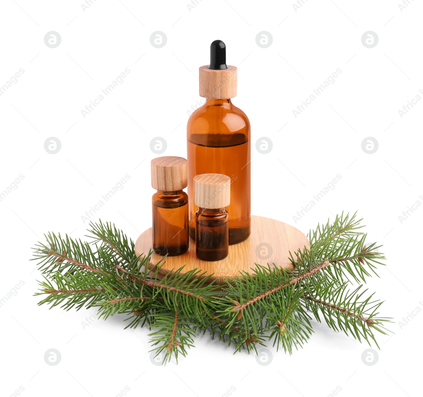 Bottles of pine essential oil on white background Photo of Bottles of pine essential oil on white background