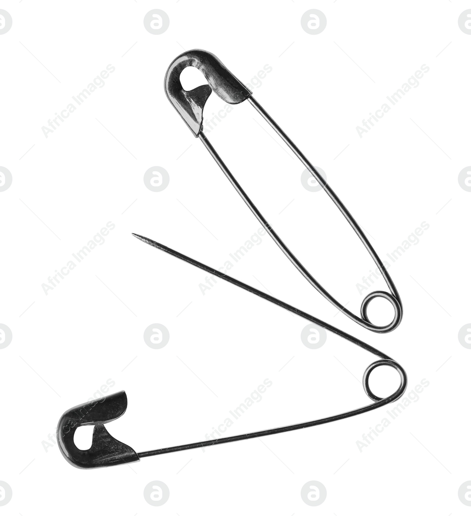 Photo of Metal safety pins on white background, top view