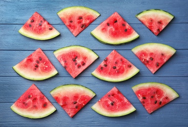 Photo of Flat lay composition with watermelon slices on wooden background