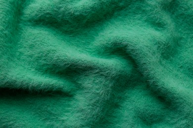 Beautiful green fabric as background, top view