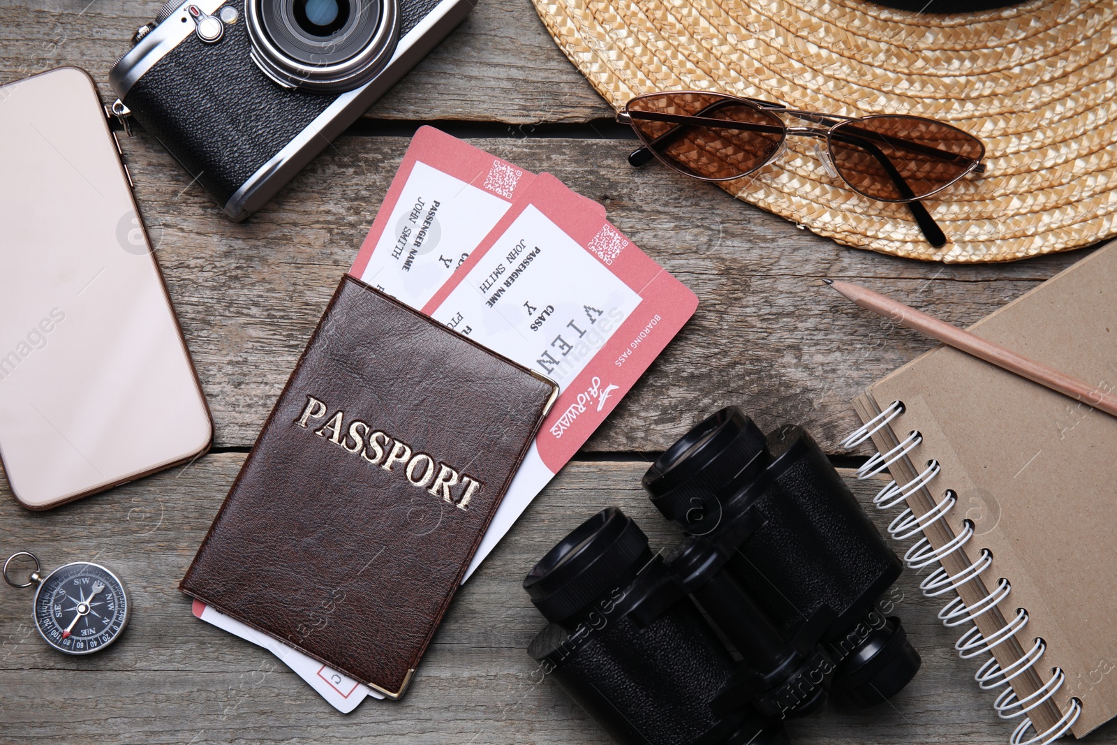 Photo of Flat lay composition with passport and tickets on wooden table