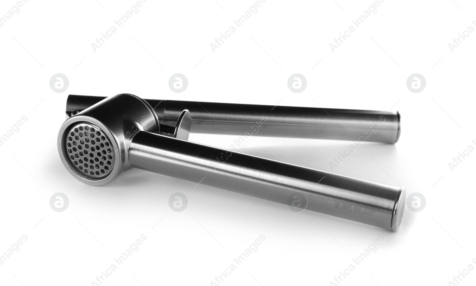 Photo of Garlic press on white background. Kitchen utensil