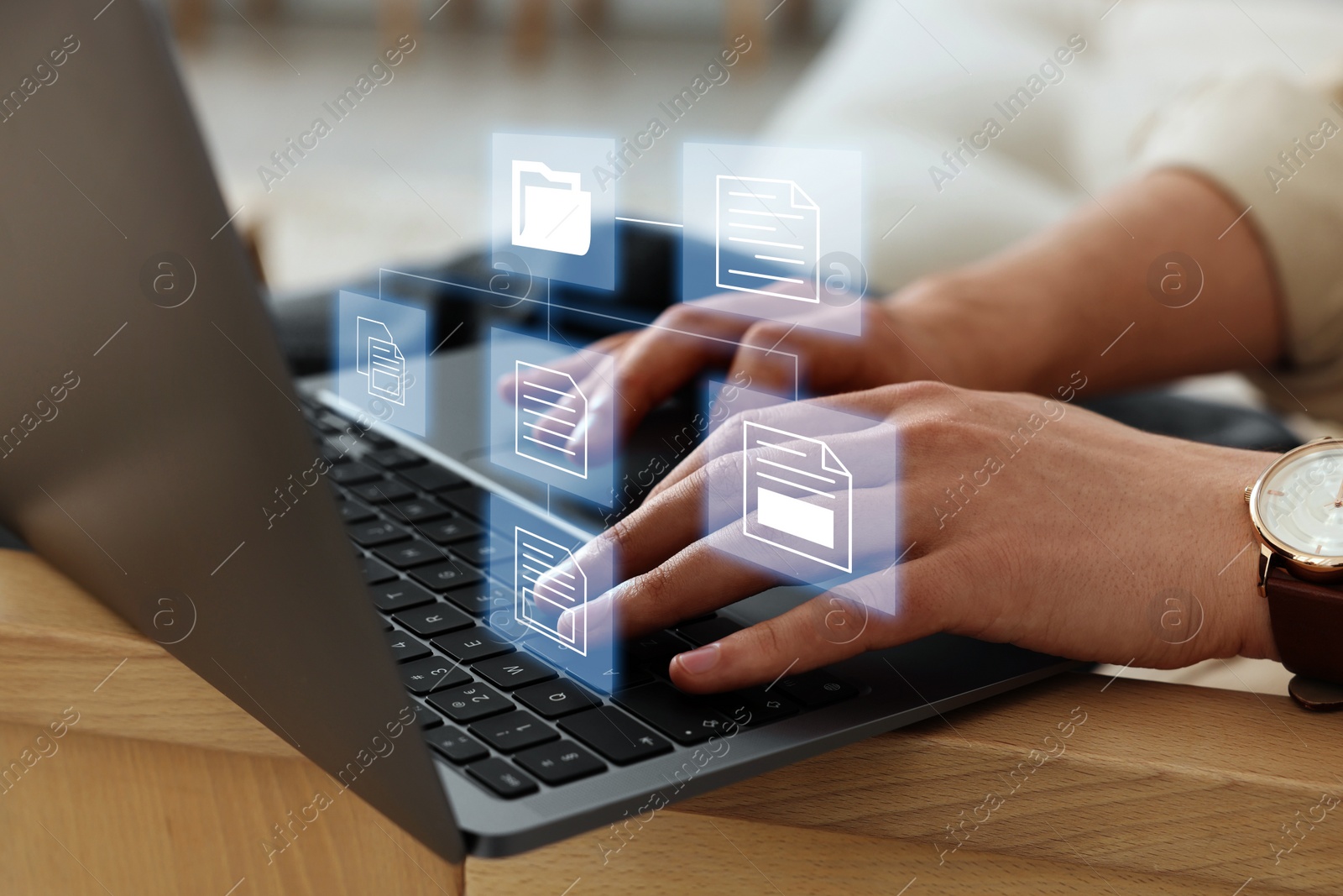 Image of File system. Man using laptop at table, closeup. Scheme with folders and documents over computer