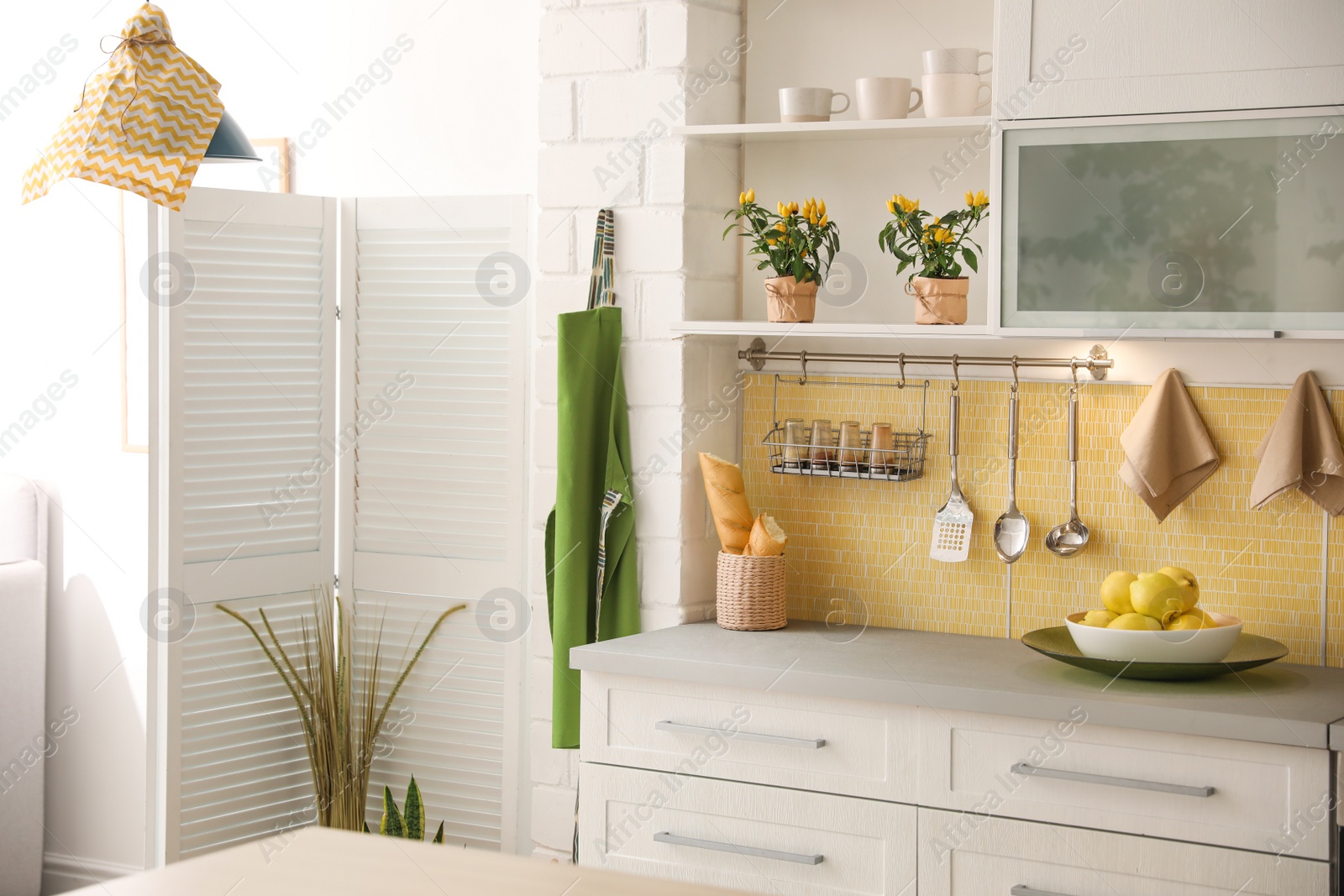 Photo of Modern kitchen interior with stylish white furniture