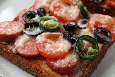 Tasty pizza toast on plate, closeup view