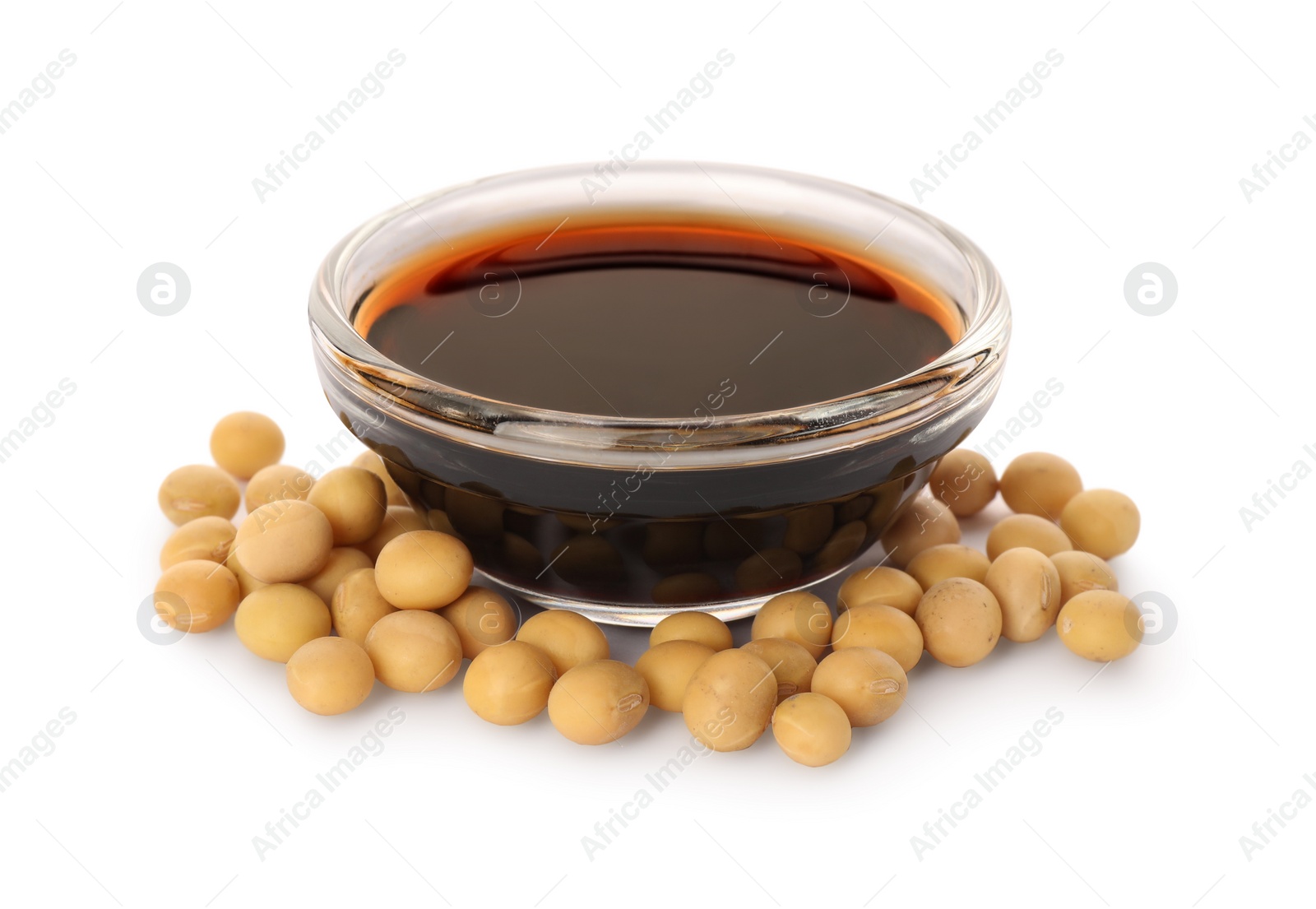 Photo of Bowl of soy sauce and soybeans on white background