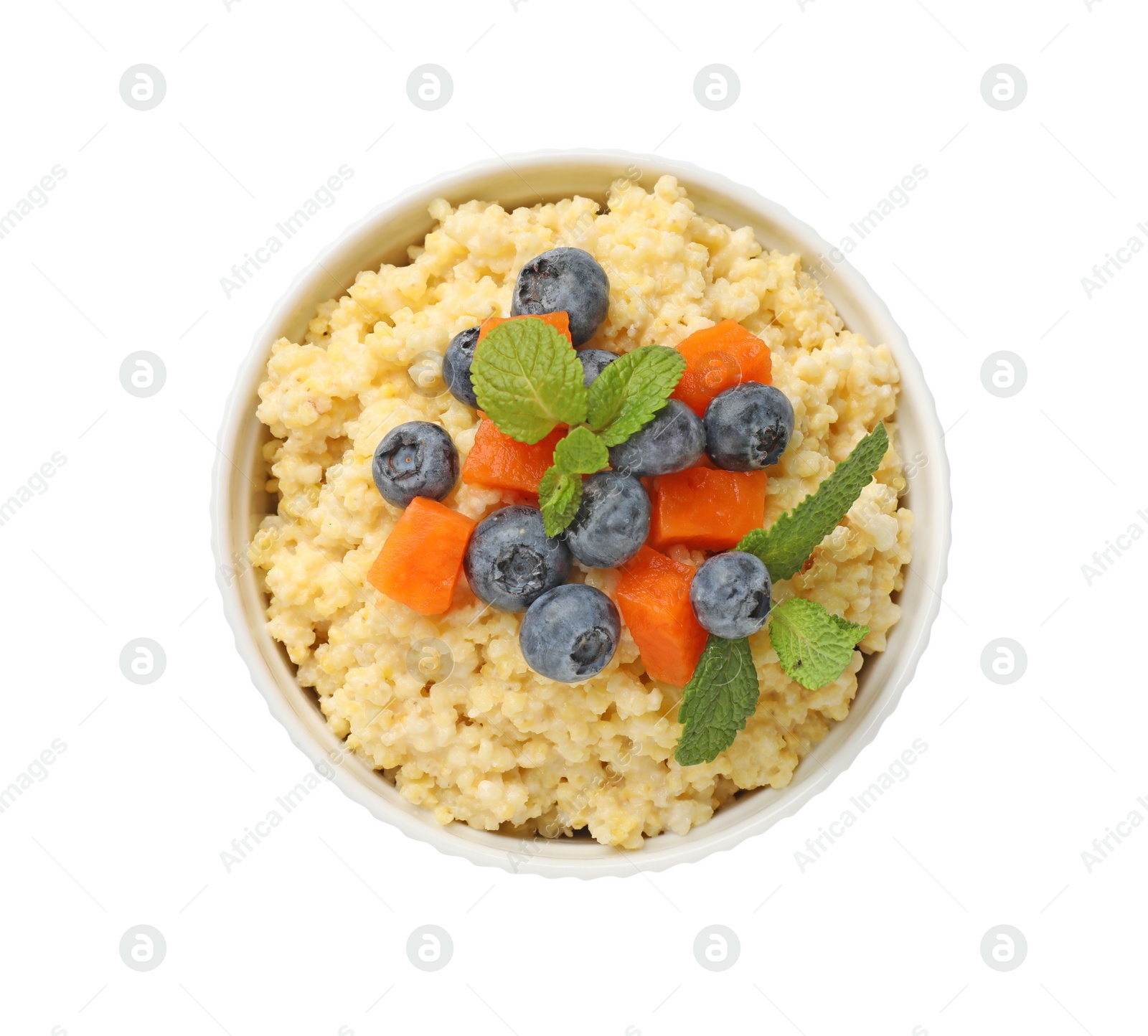 Photo of Tasty millet porridge with blueberries, pumpkin and mint in bowl isolated on white, top view