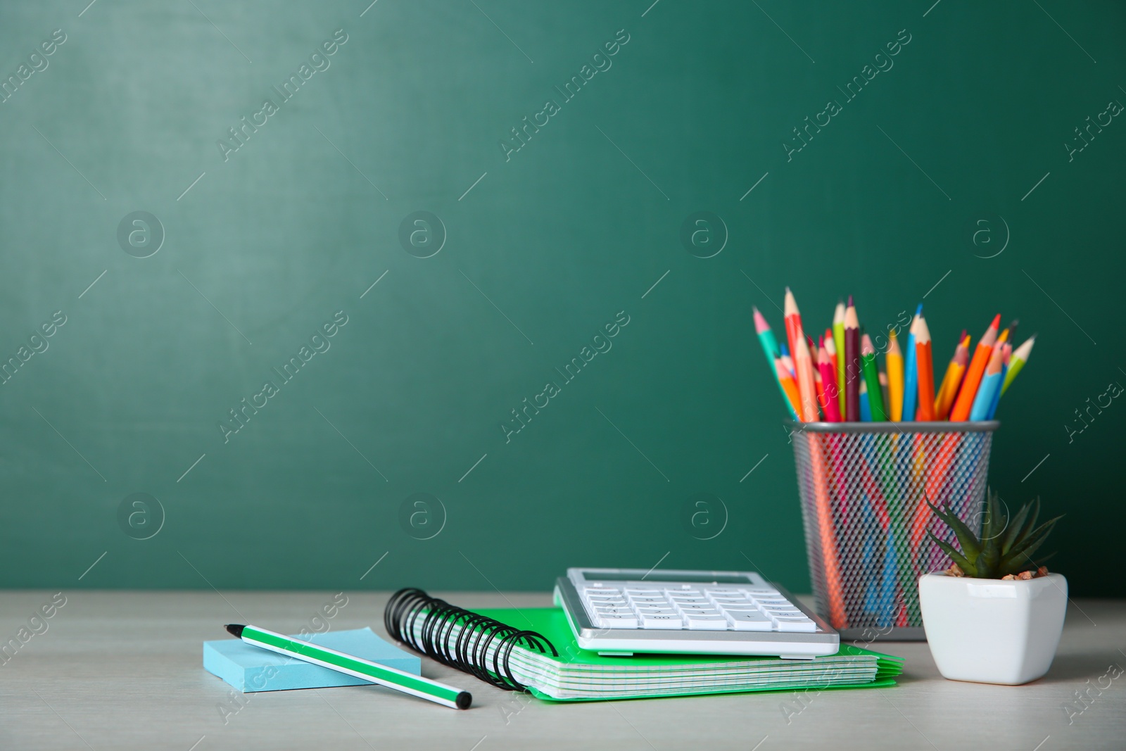 Photo of School stationery on white wooden table, space for text. Doing homework