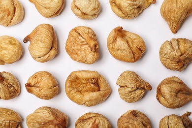 Photo of Flat lay composition with dried figs on  white background. Healthy fruit