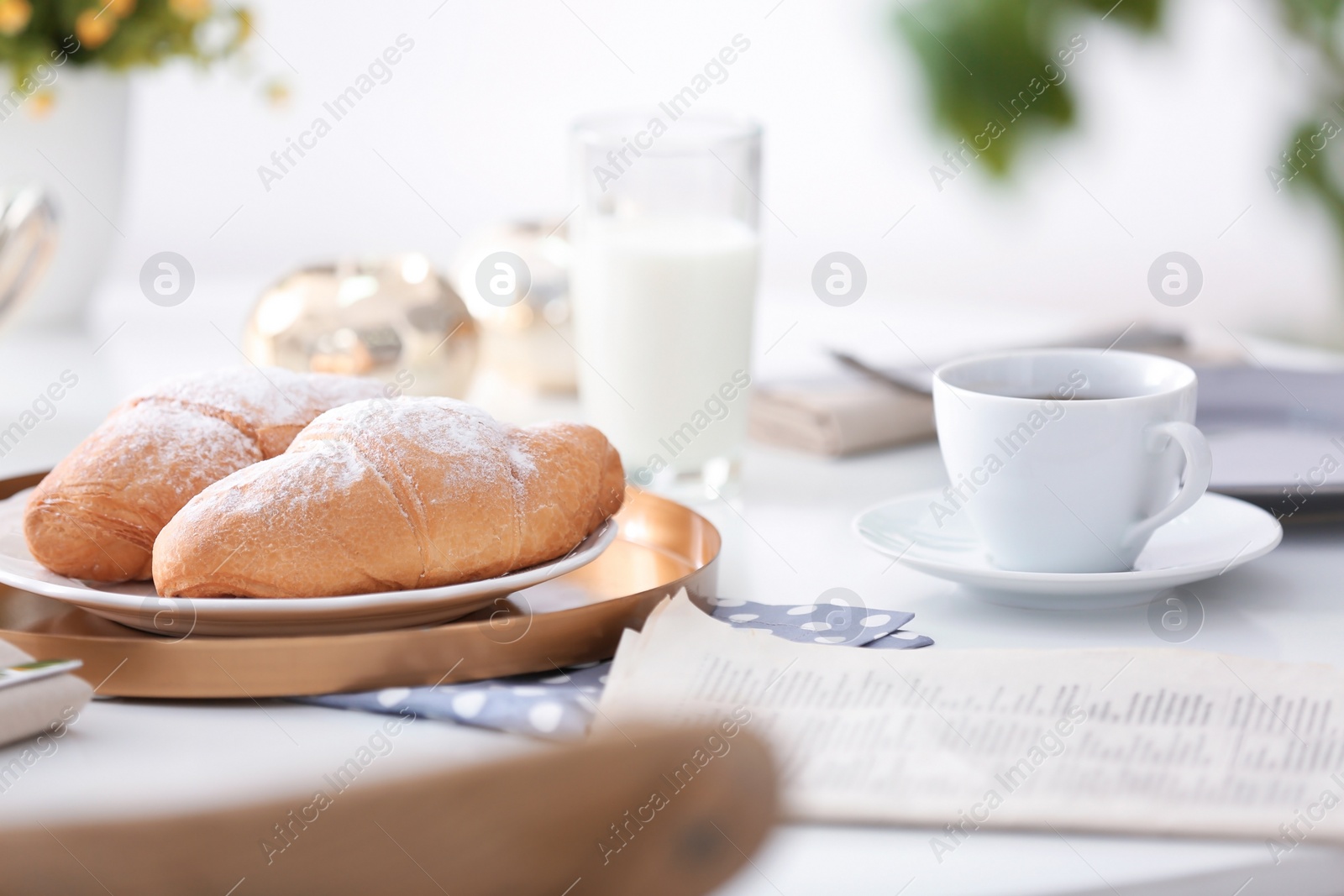 Photo of Tasty breakfast with fresh croissants on table