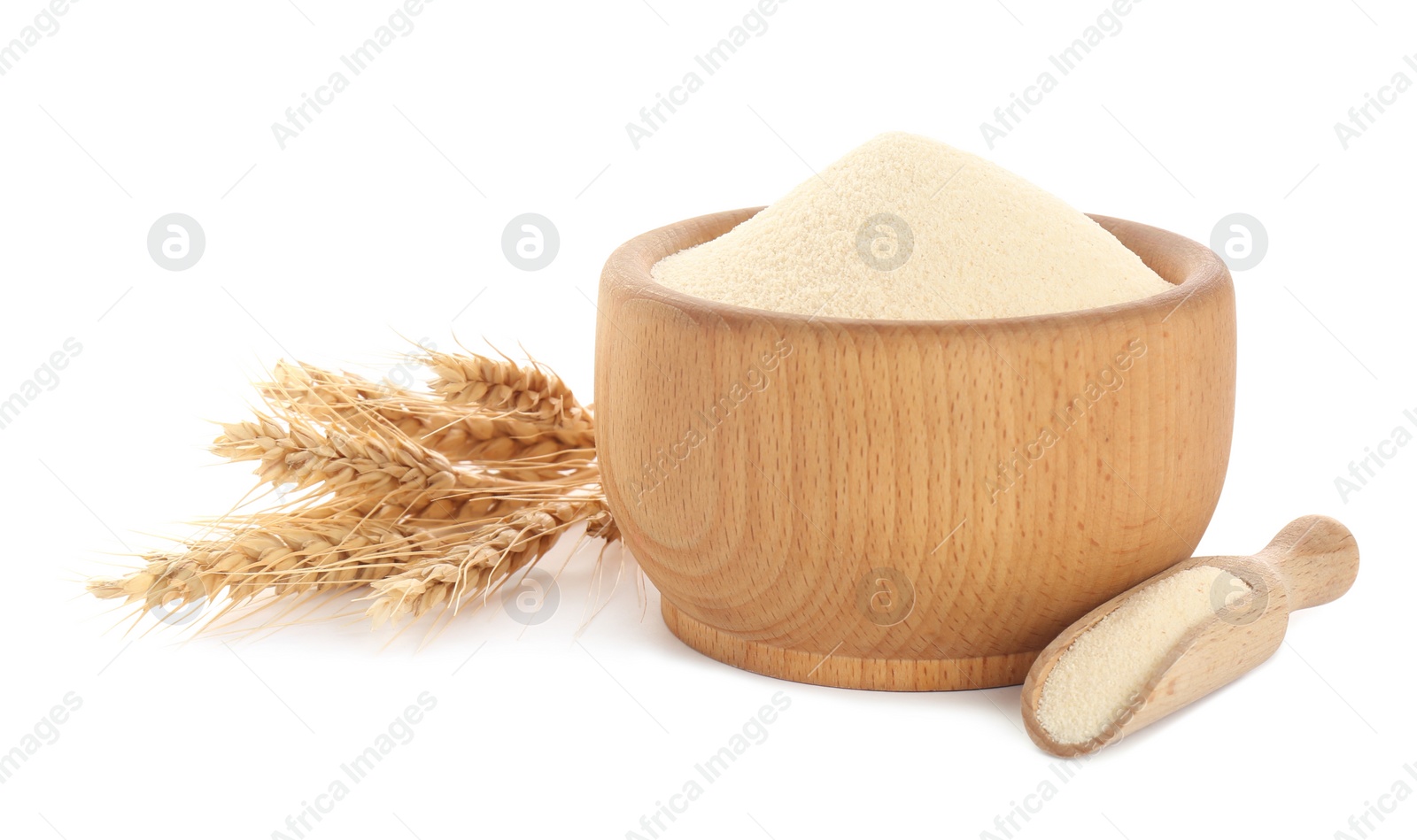 Photo of Semolina in wooden bowl and scoop on white background