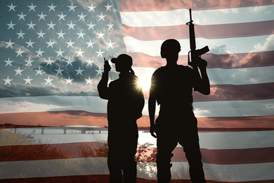 Double exposure with silhouettes of soldiers and American flag. Military service