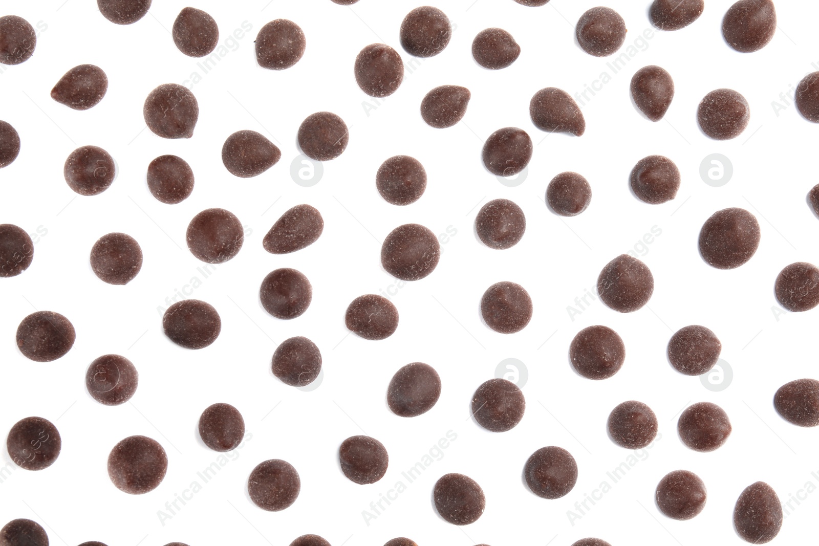 Photo of Delicious dark chocolate chips on white background, flat lay