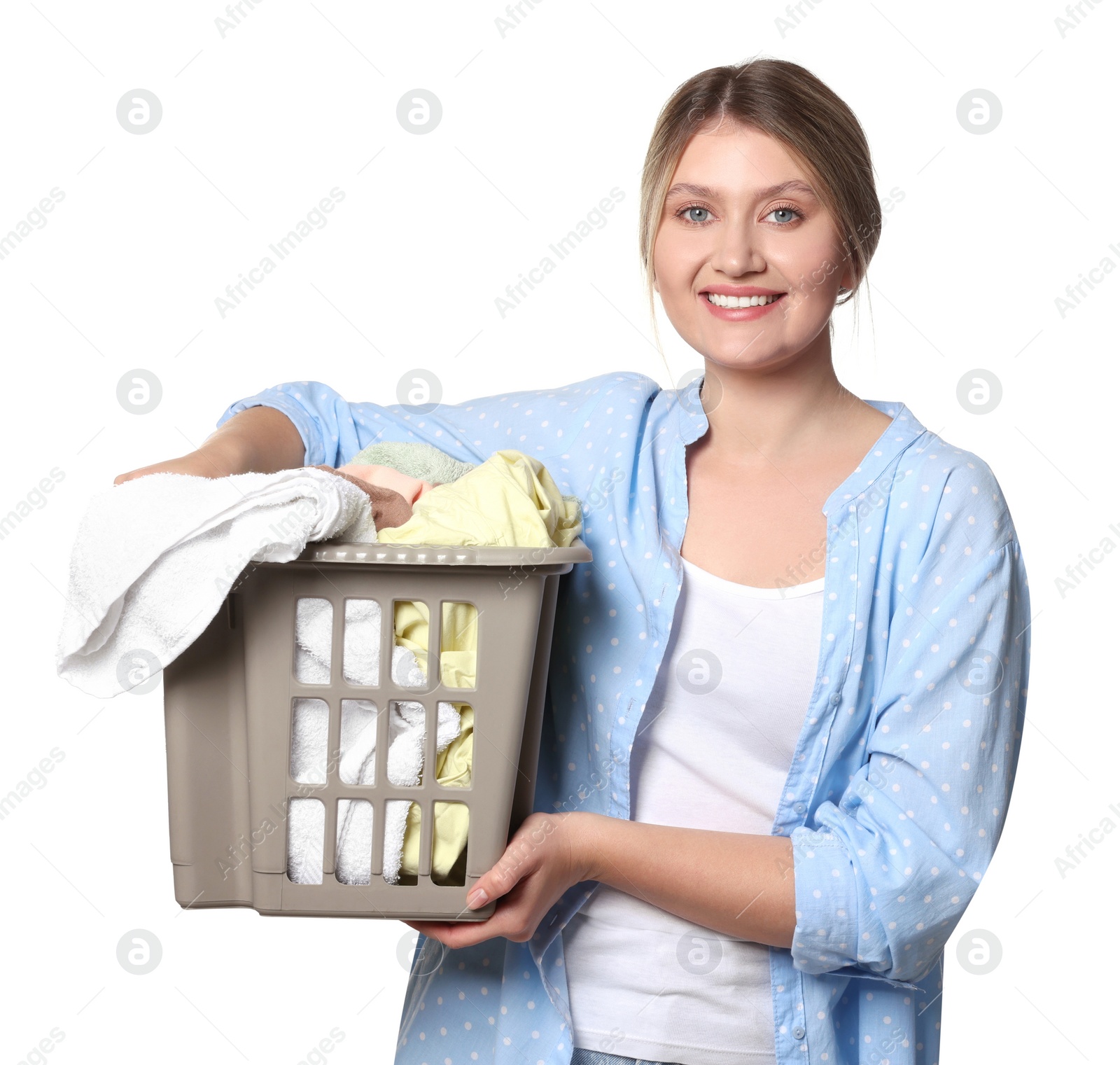 Photo of Happy woman with basket full of laundry on white background
