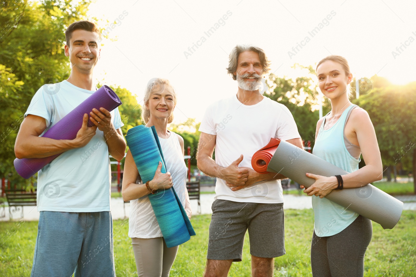 Photo of Group of people before morning yoga practice in park