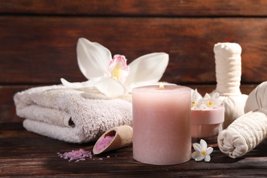 Composition with spa supplies and flowers on wooden table