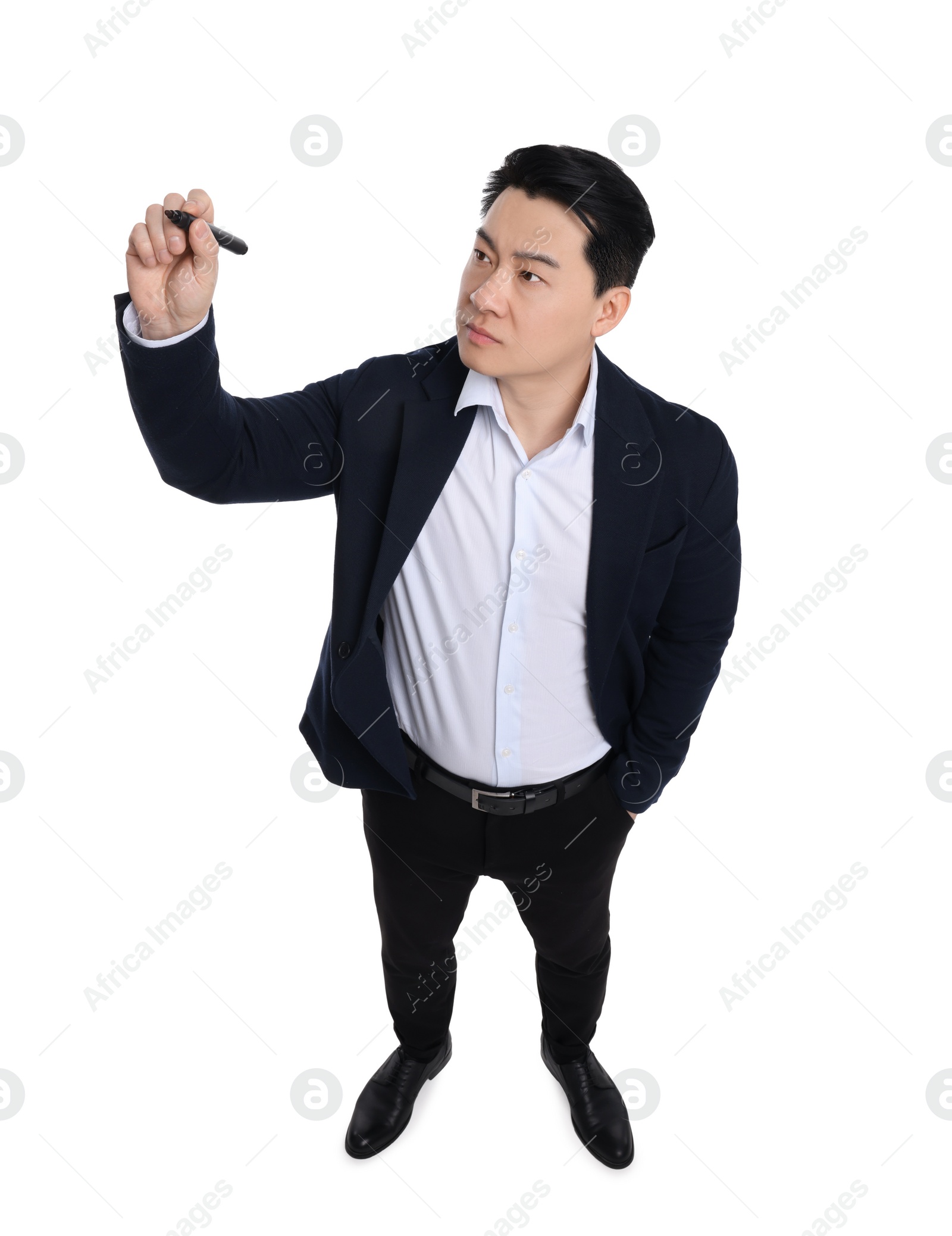 Photo of Businessman in suit with marker writing on white background, above view