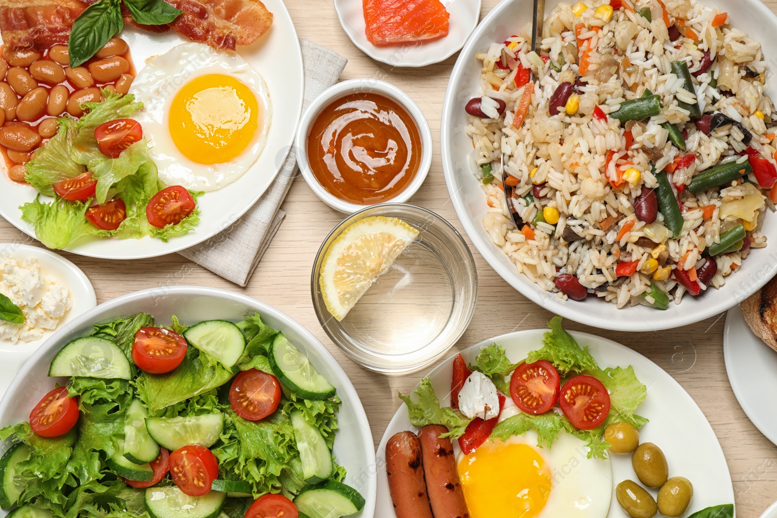 Photo of Different delicious dishes on table, flat lay. Buffet service