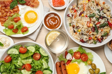 Photo of Different delicious dishes on table, flat lay. Buffet service