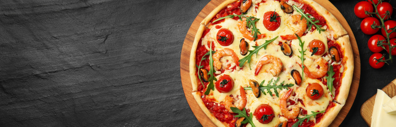 Image of Top viewhot delicious pizza on dark table, space for text. Banner design 