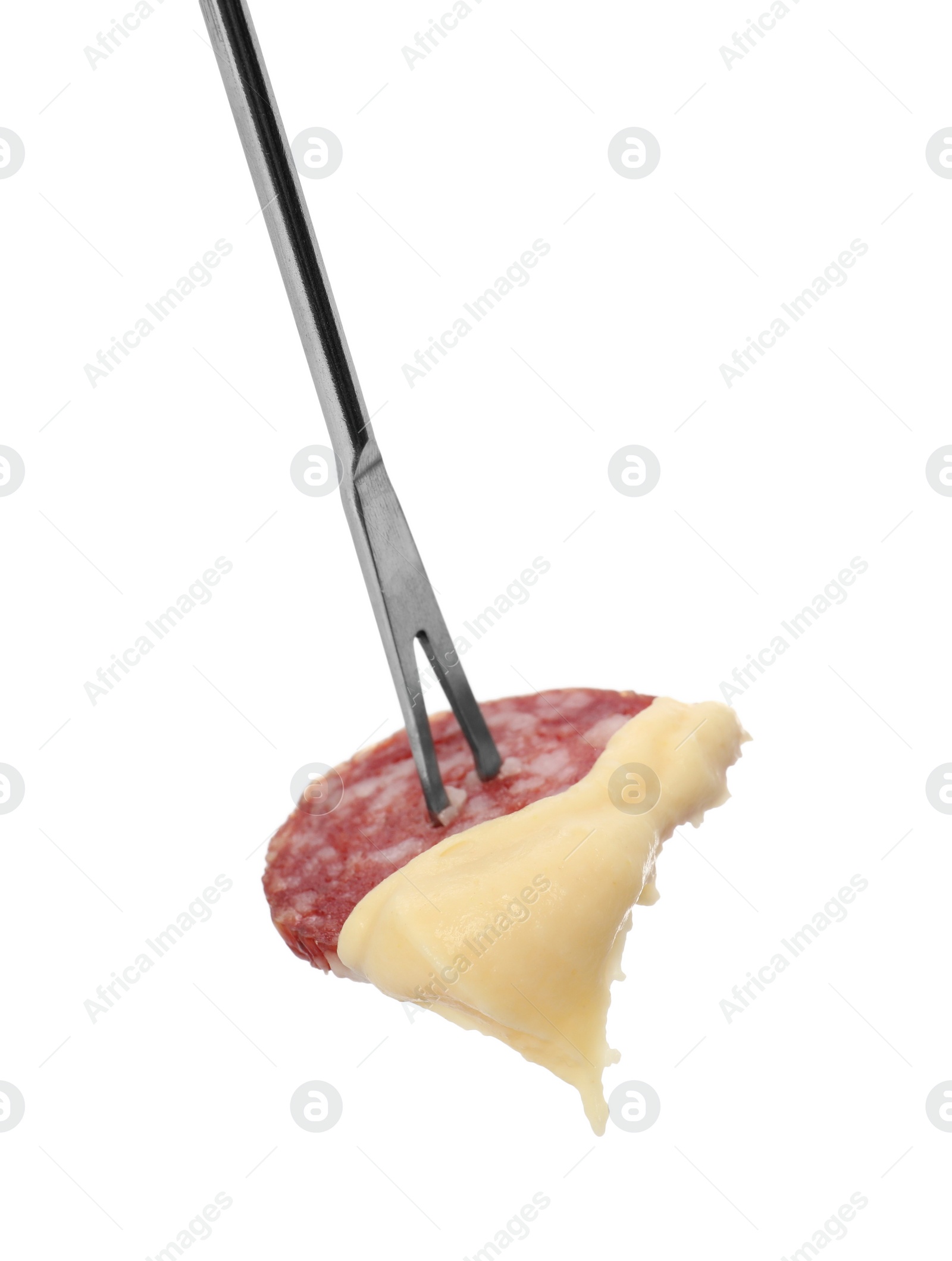 Photo of Tasty fondue. Fork with salami and melted cheese isolated on white