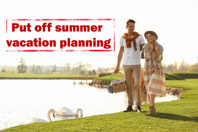 Image of Vacation cancellation concept. Young couple with picnic basket near lake on sunny day 