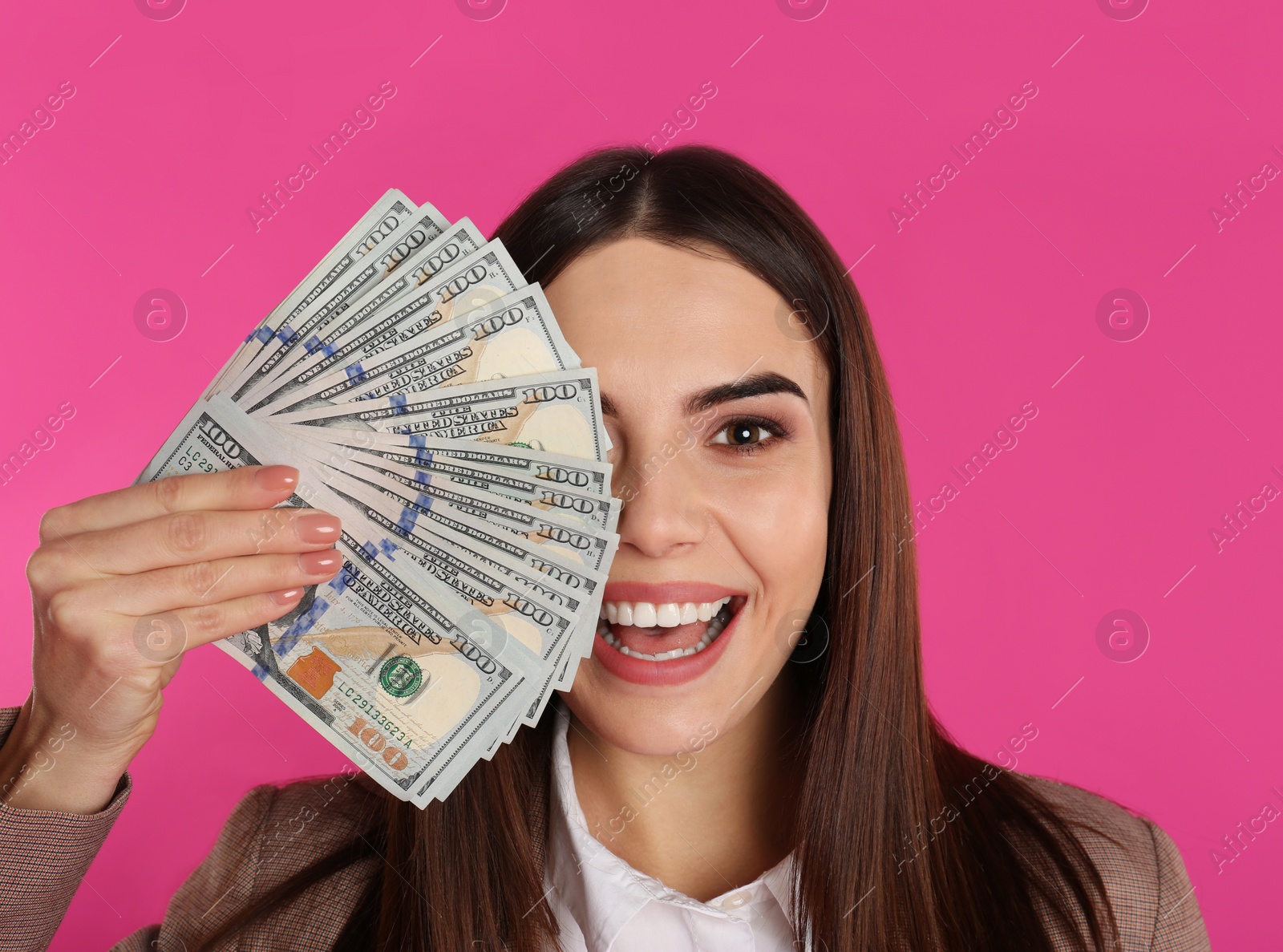 Photo of Young businesswoman with money on color background