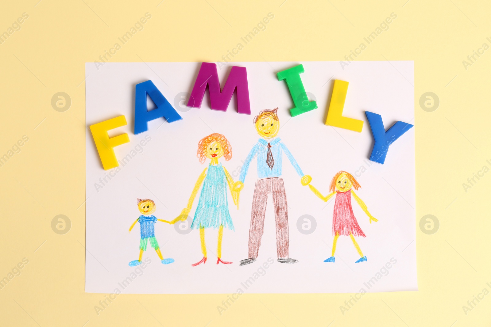 Photo of Word Family made of colorful letters and picture on pale yellow background, flat lay