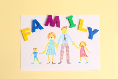 Photo of Word Family made of colorful letters and picture on pale yellow background, flat lay