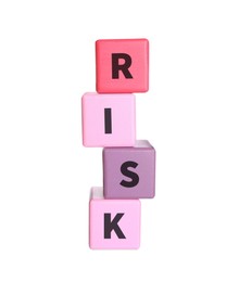 Photo of Woman stacking color wooden cubes with word Risk on white background, closeup