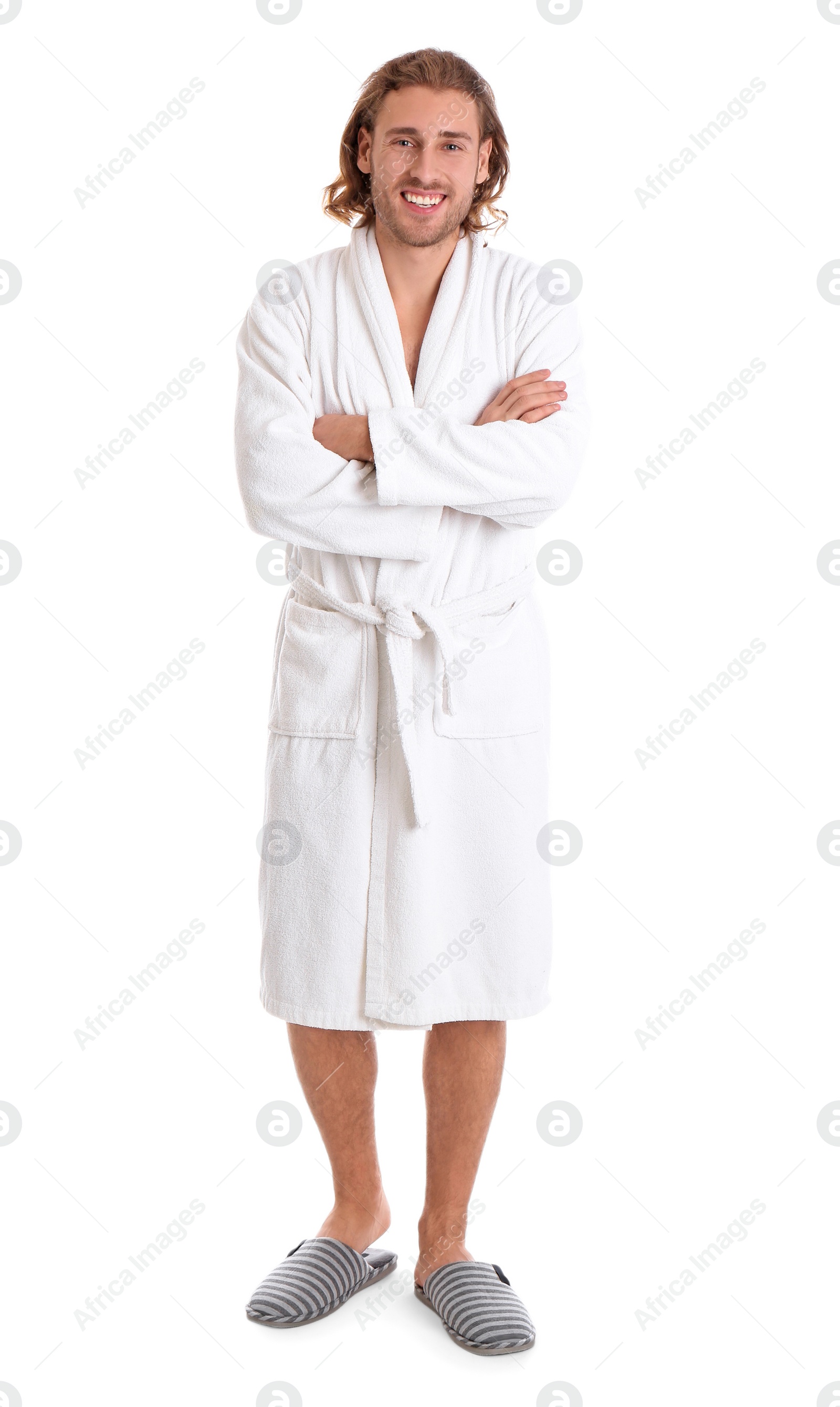 Photo of Young man in bathrobe on white background