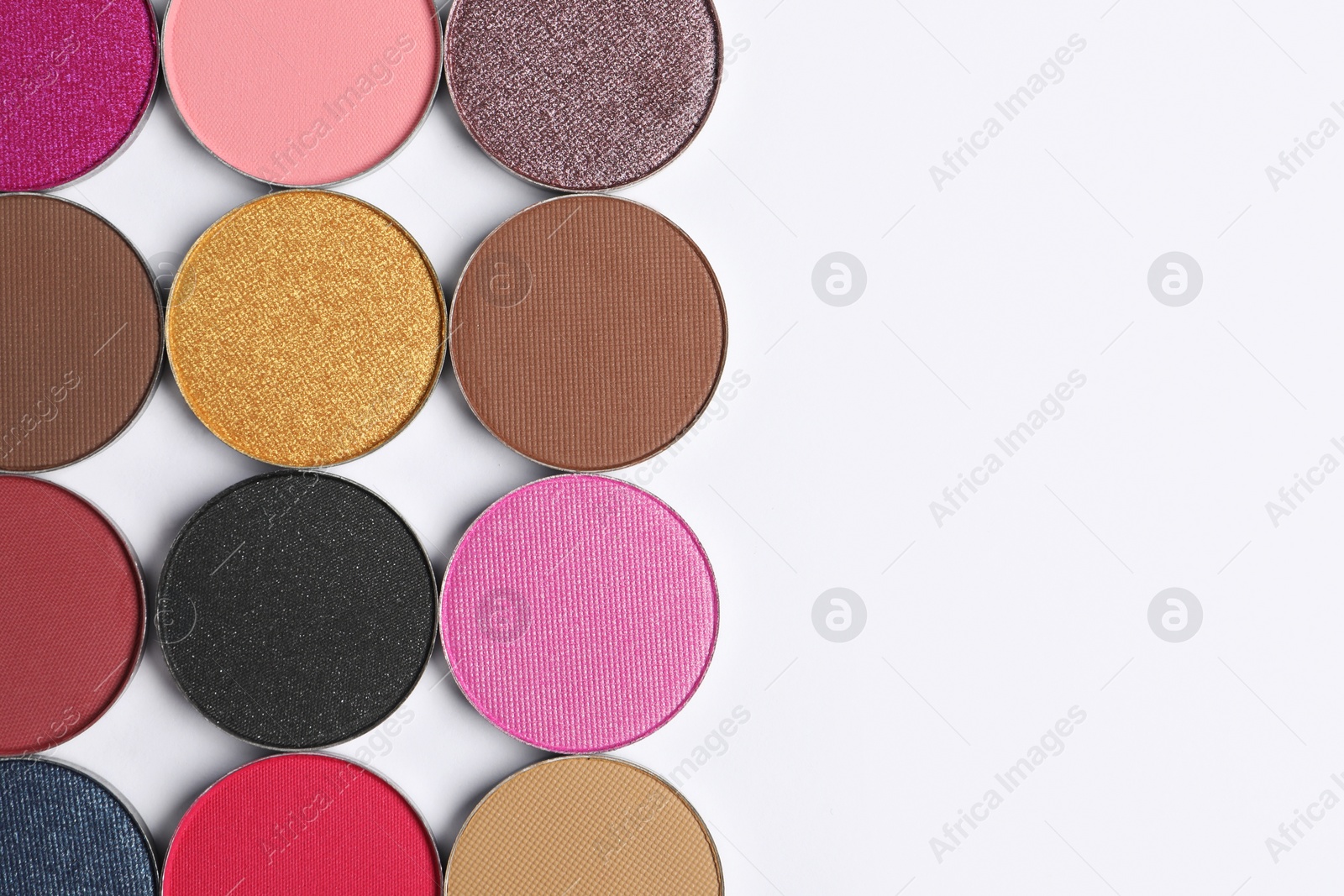 Photo of Beautiful eye shadow refill pans on white background, flat lay. Space for text