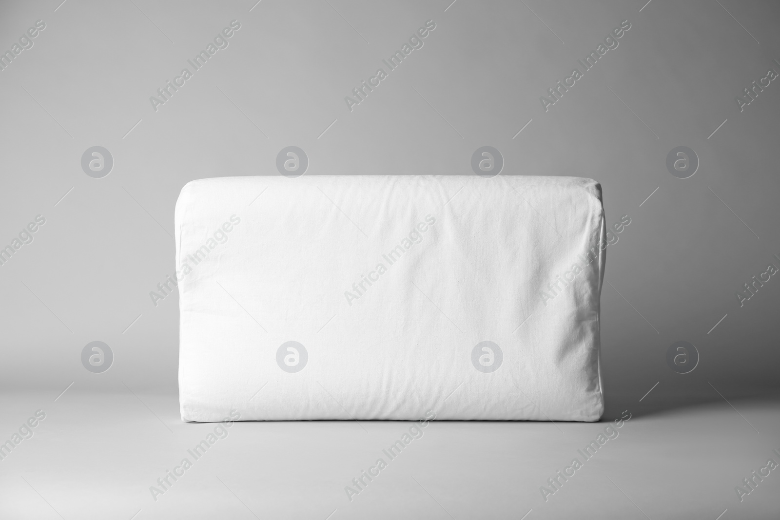 Photo of Blank soft pillow on light background