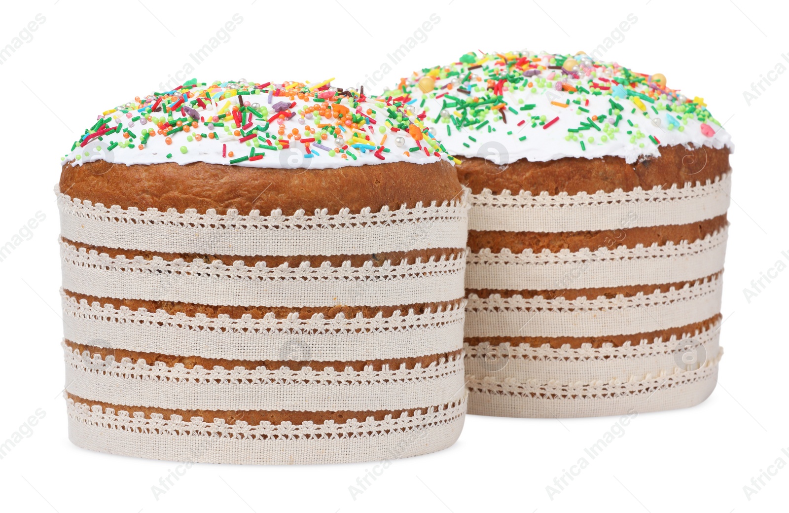 Photo of Traditional Easter cakes with sprinkles on white background